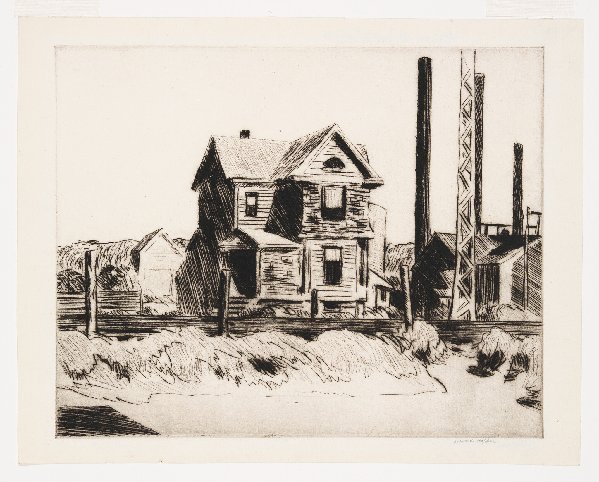 A black and white etching depicting a dilapidated two-story house with a porch, situated next to industrial structures with tall smokestacks. The foreground shows rough, grassy terrain, and a wooden fence partially obscures the house. The contrast between the residential building and the industrial backdrop suggests a commentary on industrialization's impact on domestic life.