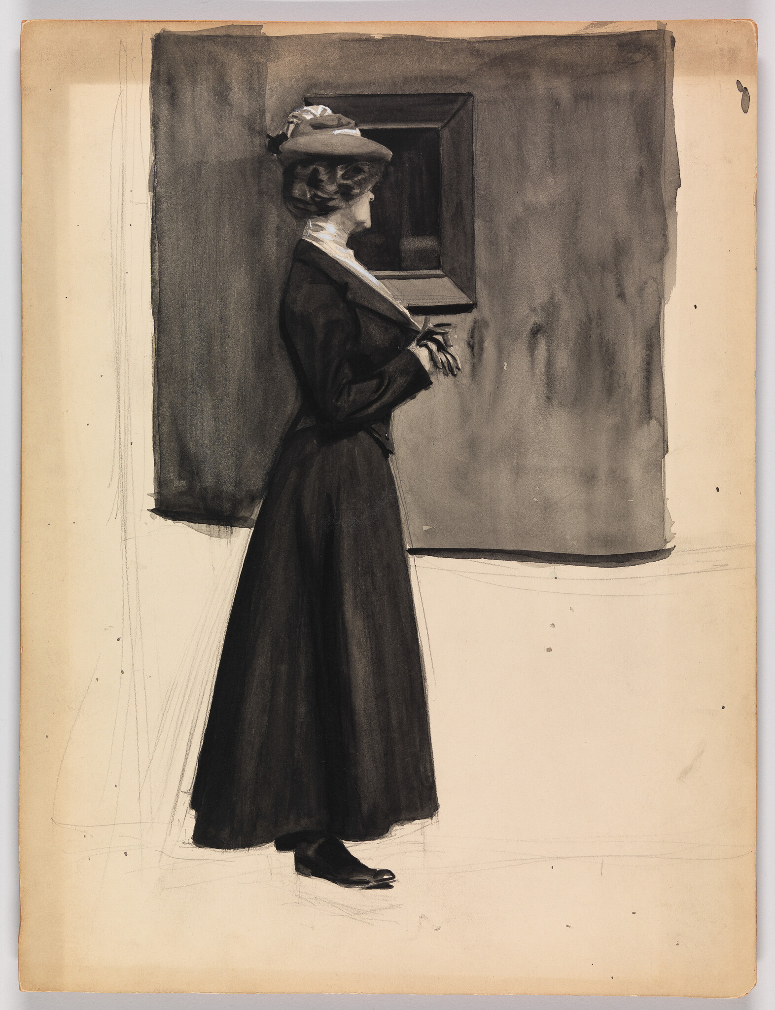 A woman in a long dark dress and hat stands with clasped hands studying a framed painting.