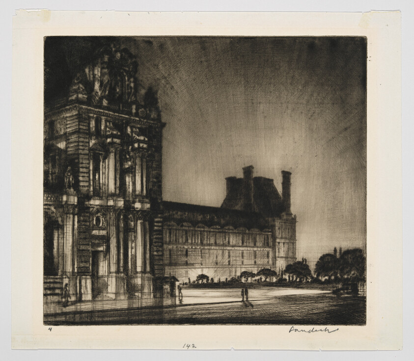 An ornate stone building with people walking in the courtyard at dusk.