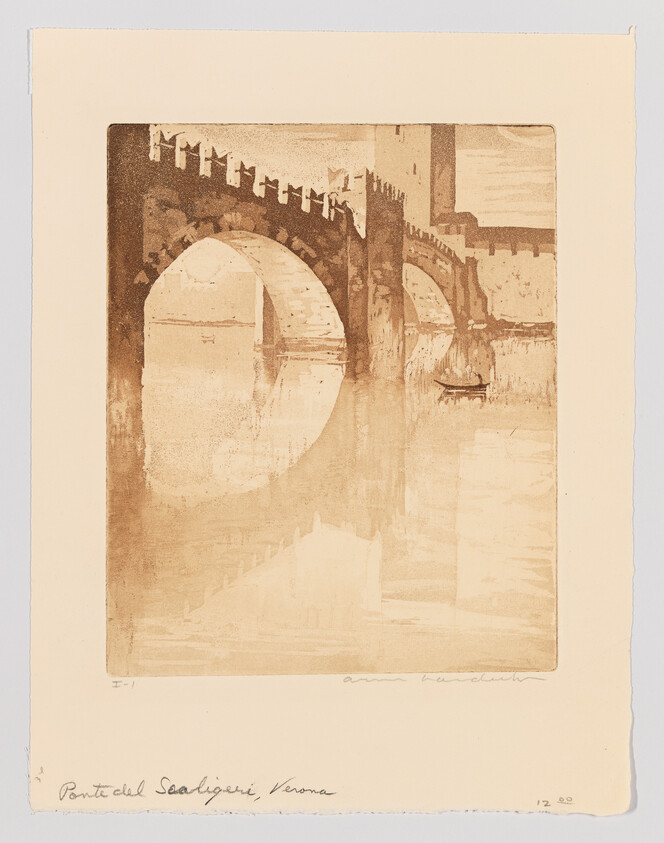 Stone arched bridge with towers reflected in a calm river and a small boat beneath.