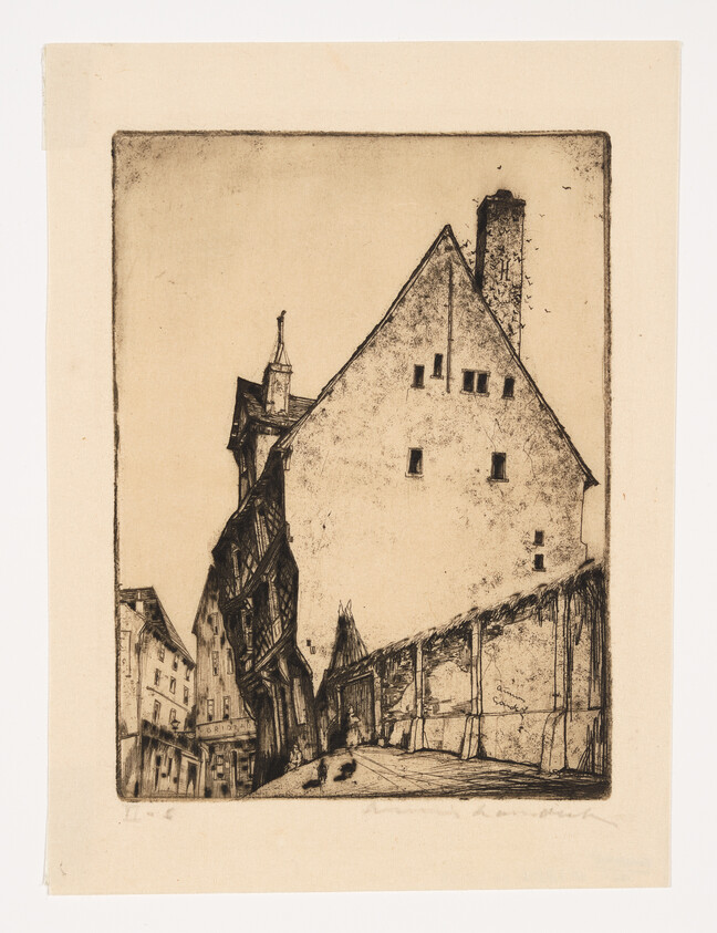 Tall triangular-roofed building and leaning half-timbered houses lining a narrow cobblestone street.