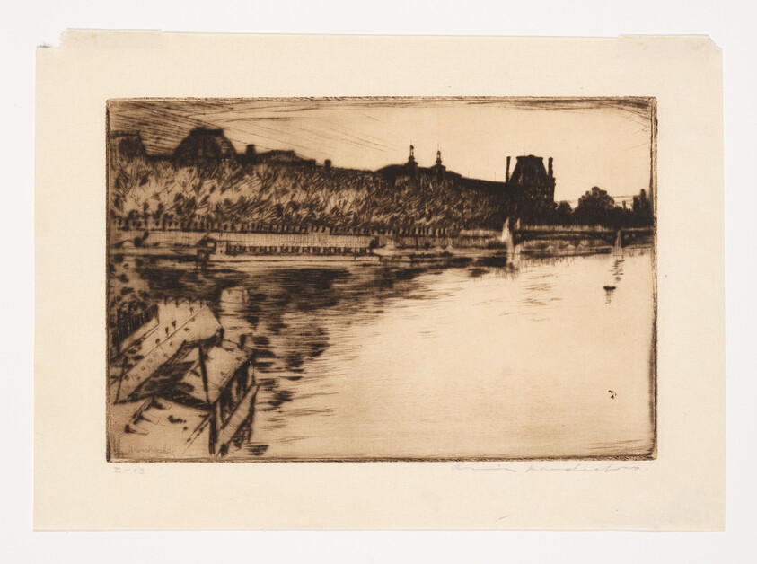 Small boats rest along a calm river with distant buildings and trees on the far bank.