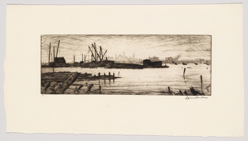 A quiet industrial waterfront with cranes, docks, and a distant city skyline across the water.