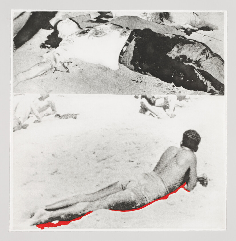 A shirtless person lies face down on the sand with a red stain highlighted beneath them.