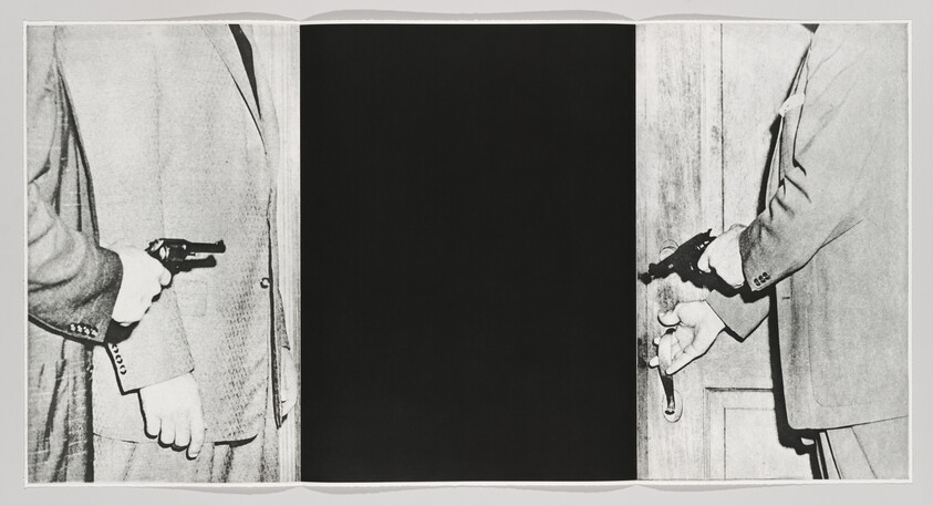 Two suited men point revolvers at each other across a doorway with a dark center.