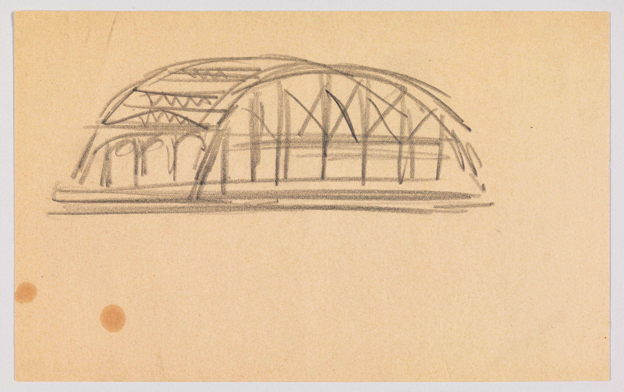 Pencil sketch of a domed structure with visible internal struts and arches on a tan paper background. Two small, round stains are present near the bottom left corner of the paper.