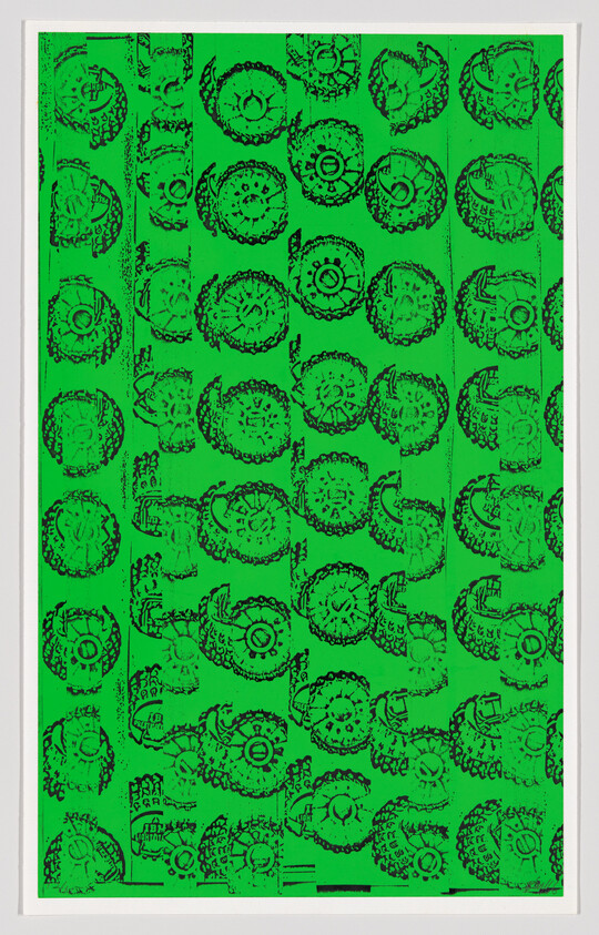 Bright green sheet covered with repeating black circular stamp-like patterns arranged in vertical columns.