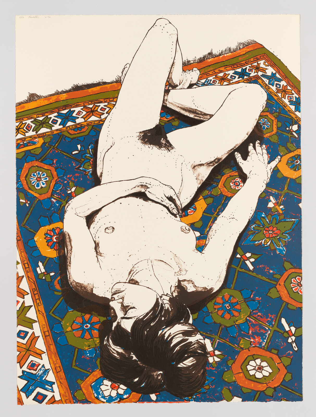 A nude person lies relaxed on a colorful patterned rug with hands resting near the chest.