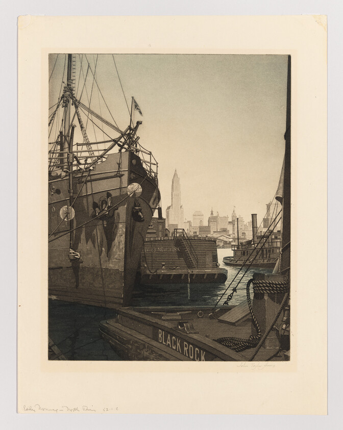 Large ship docked in harbor with tugboat labeled "Black Rock" and city skyline behind.