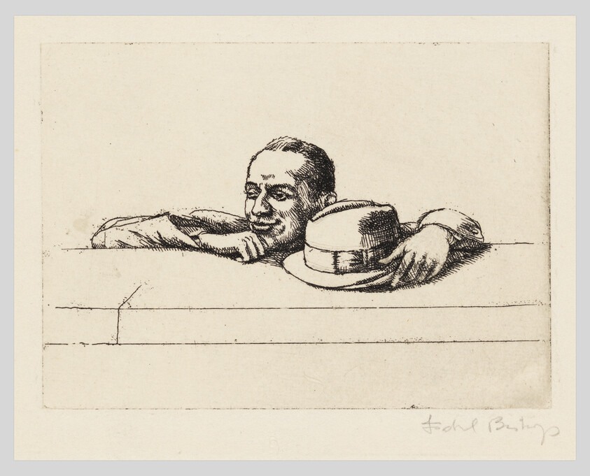 A man leans on a low wall, resting his chin on his hand and holding a hat.