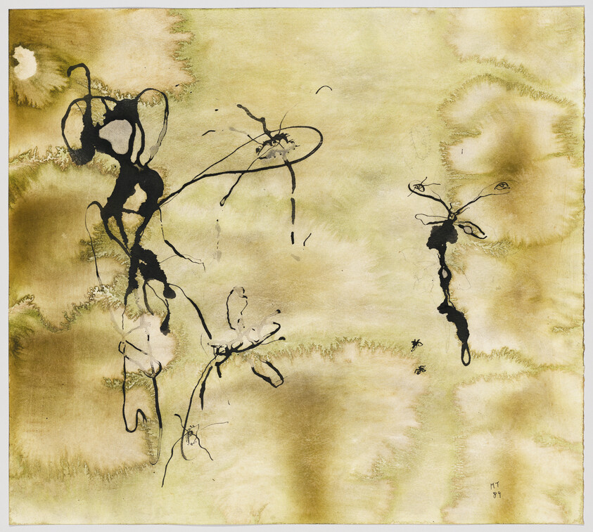An abstract painting featuring spontaneous black ink lines and splatters on a textured, yellow-ochre background. The ink forms erratic shapes and patterns, some resembling organic forms or calligraphic strokes, with a sense of movement and fluidity. The artwork has a raw, expressive quality, and there's a signature with the date '87 in the bottom right corner.