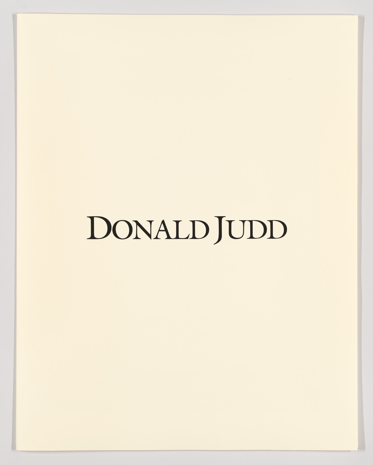 Cream poster with bold black text reading Donald Judd centered on the page.