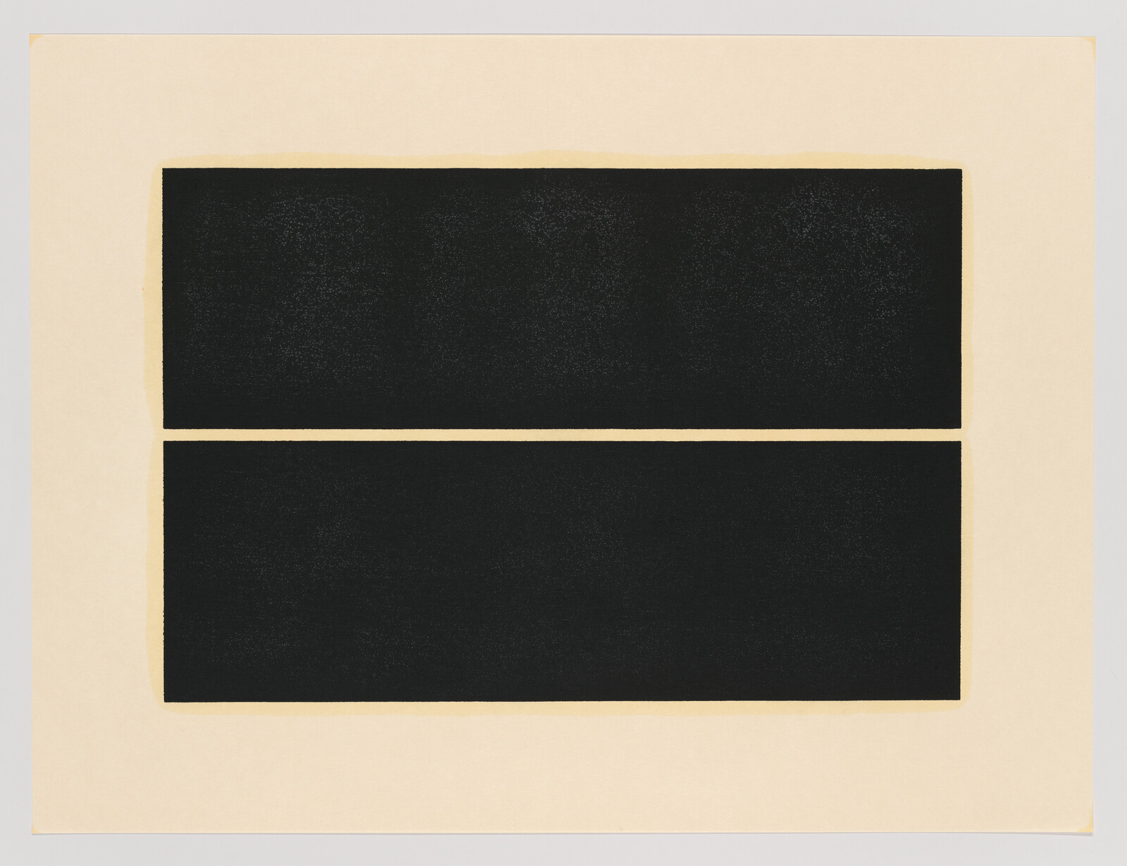 Two large black rectangles stacked vertically on a beige sheet, separated by a thin horizontal gap.