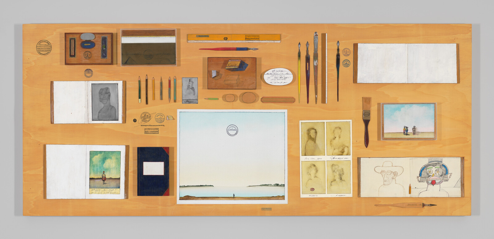 Artist's organized workspace showing sketches, brushes, pencils, and a central watercolor of a lone figure by the sea.