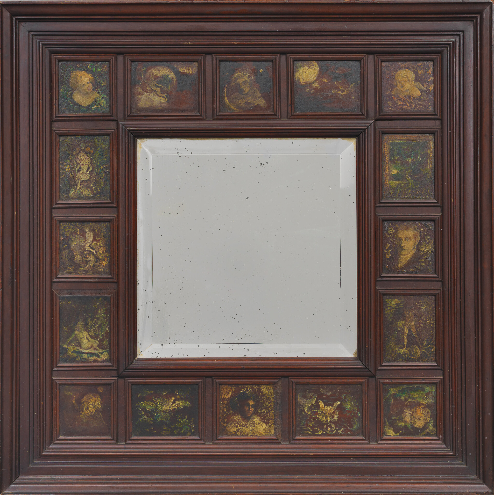 Large wooden framed mirror with small painted panels showing faces and mythic scenes.