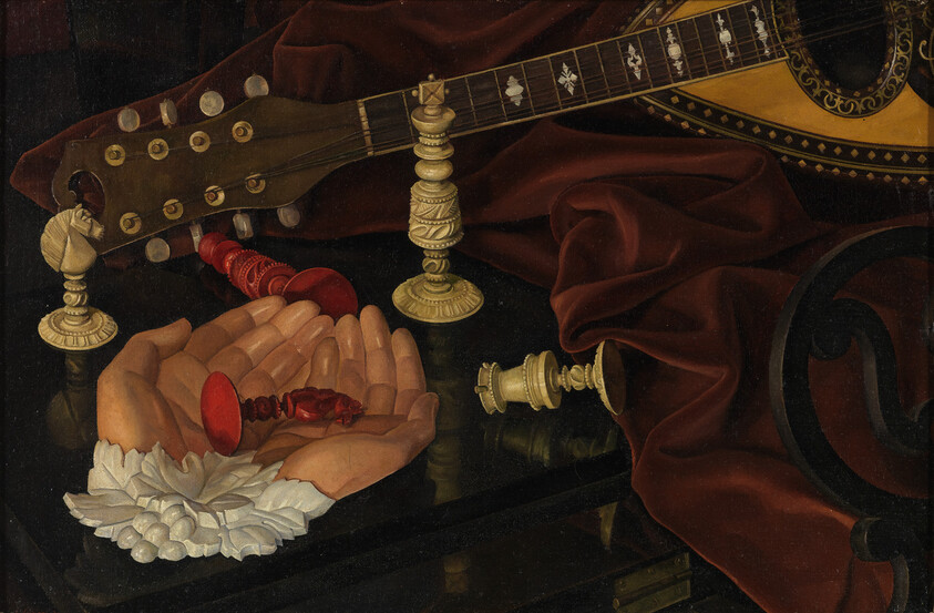 Hands holding a broken red glass goblet stem amid lute, candlesticks, and draped cloth.