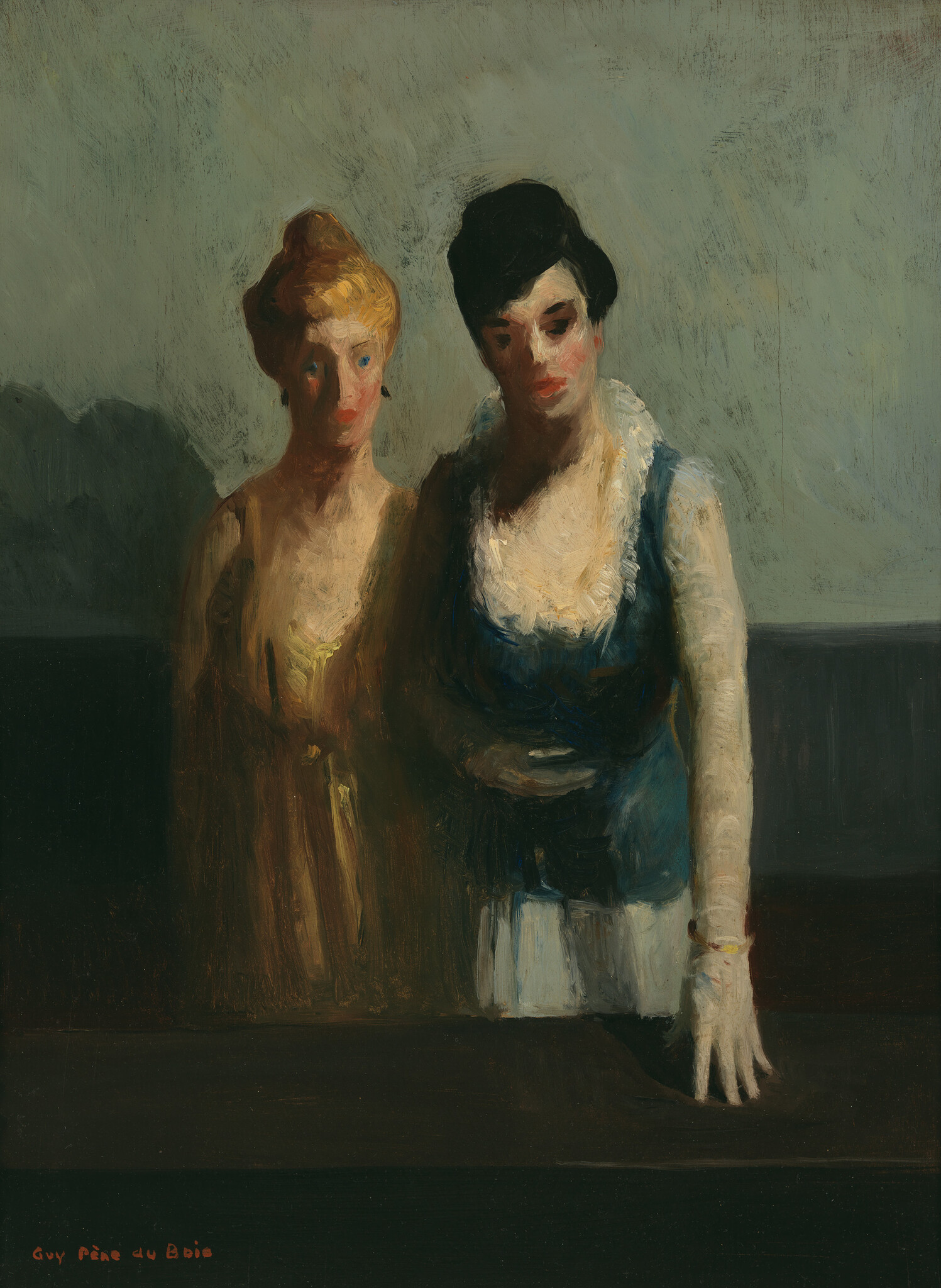 Two women stand close together by a dark table, one resting her gloved hand down.