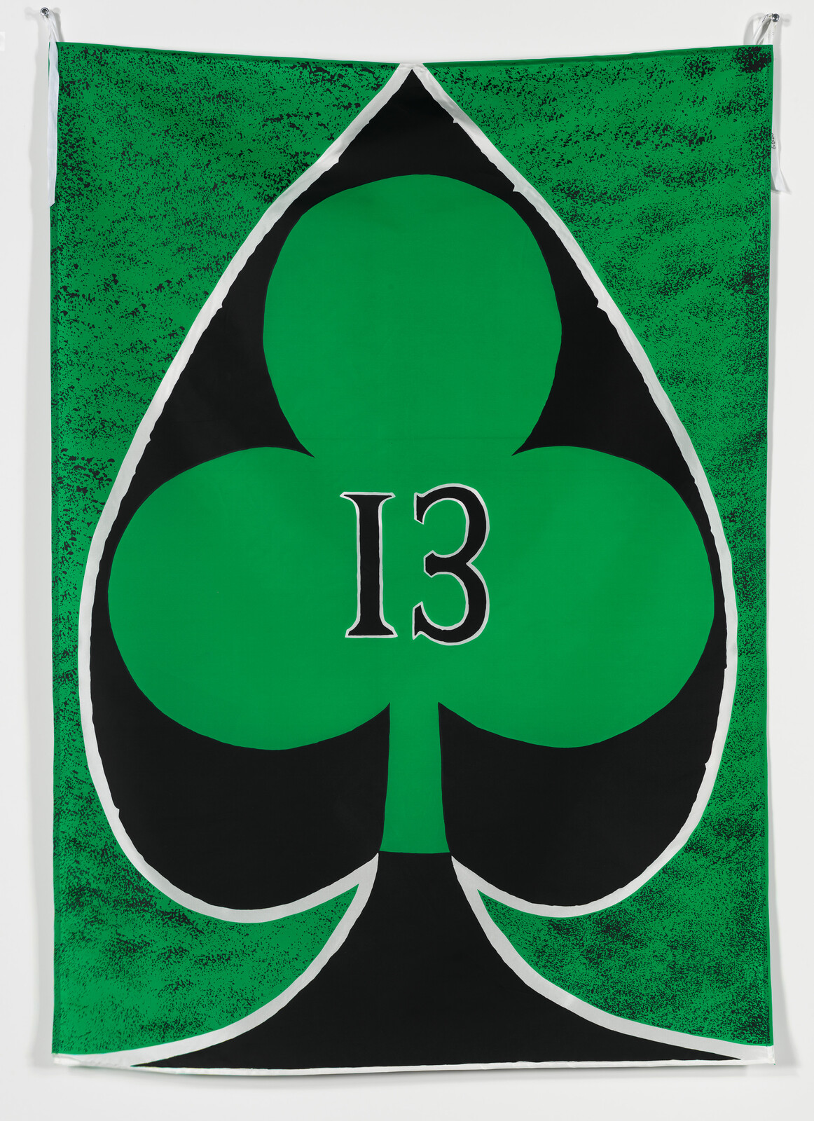 A large green club symbol with the number 13 centered on a textured green banner.