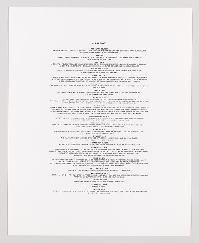 A photograph of a printed chronology document detailing significant events in a timeline format, primarily centered on the page with a large amount of white space surrounding the text.