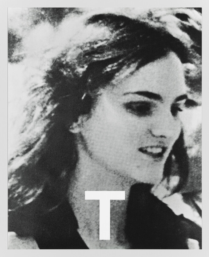 Young woman looking to the side with a large letter "T" overlaid at the lower center.