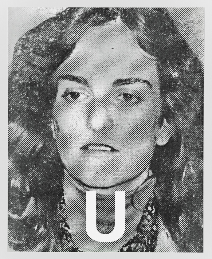 A woman's black-and-white portrait with a large letter U superimposed at her neck.