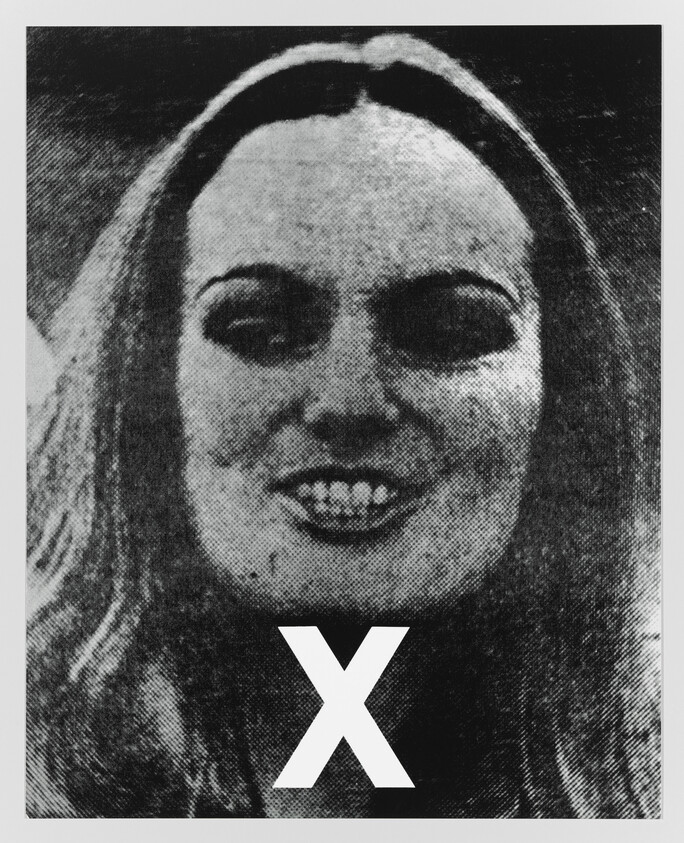 Young woman smiling with a large white X over the lower part of the portrait.