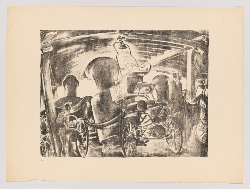 Several people sit in vintage open carriages viewed from behind under a covered platform.