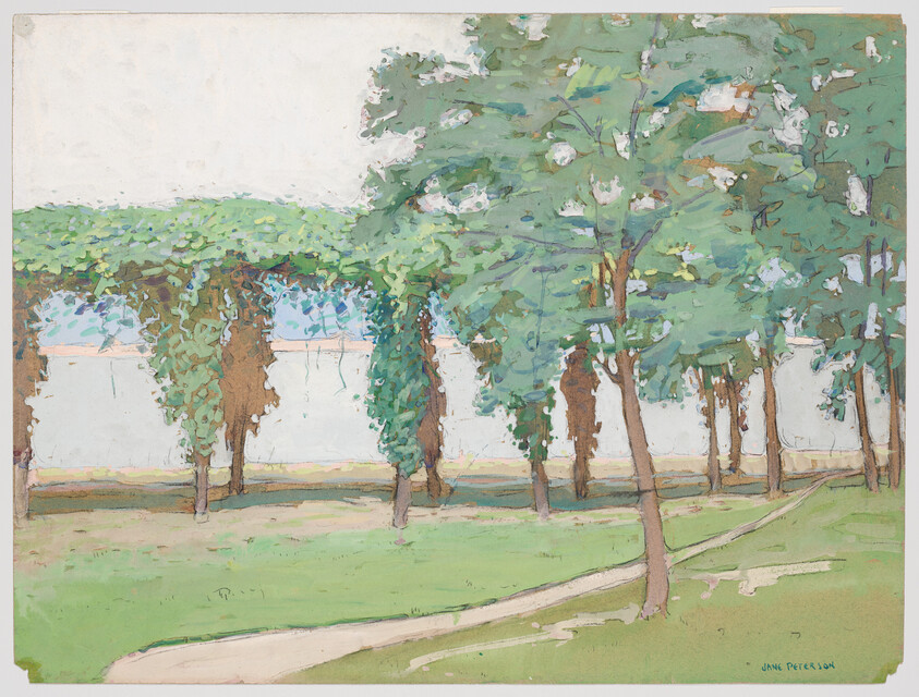 A grassy park with a winding dirt path beside a row of leafy trees and a low wall.