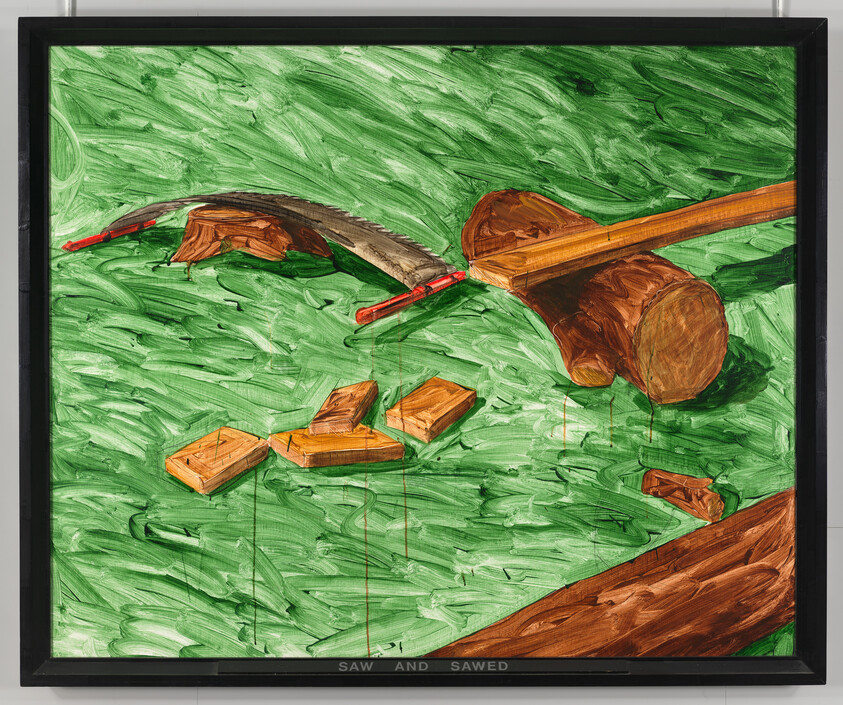 A curved saw with red handles and a mallet lies among cut wooden blocks on a green background.