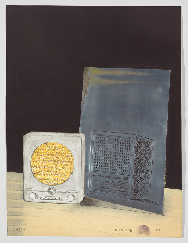 Two vintage tabletop radios, one with a textured gold speaker grille, sit on a wooden surface.