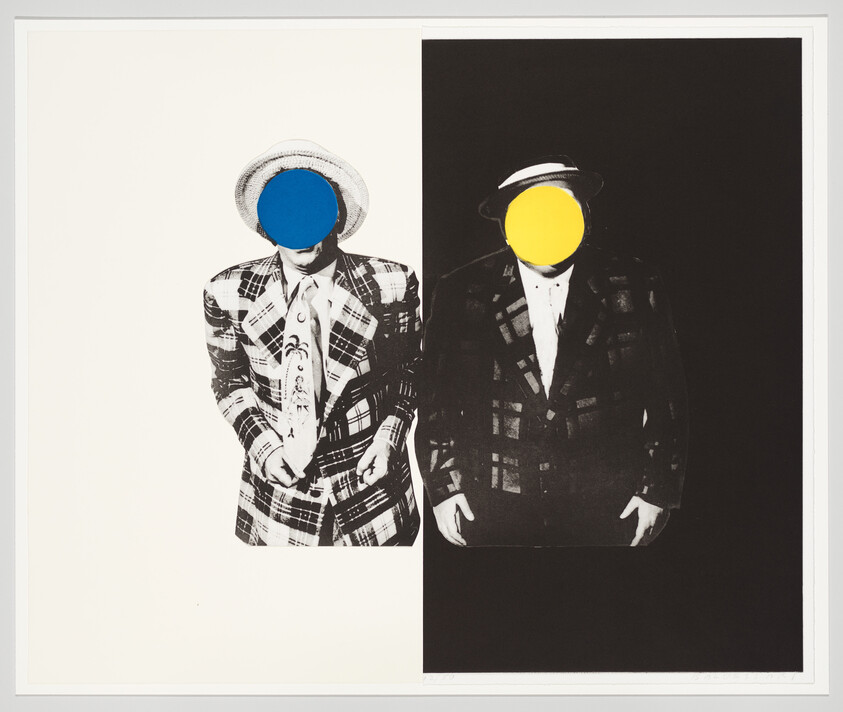 Two men in plaid suits stand side by side with blue and yellow circles covering faces.