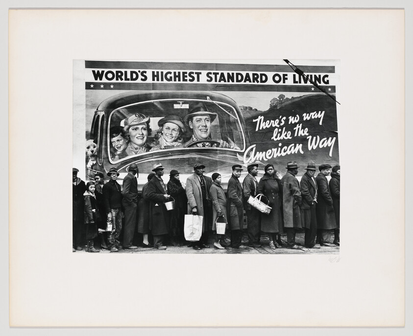 Black and white photo of people in a breadline juxtaposed with a billboard showing a happy family in a car, captioned "World's Highest Standard of Living."