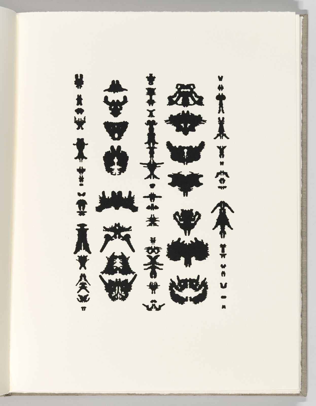 A page shows five vertical columns of black symmetrical inkblot shapes resembling Rorschach tests.