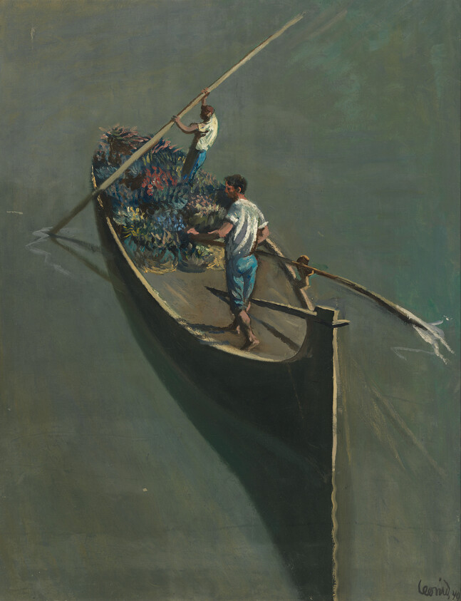 Two men push a narrow boat through calm water while handling a large load of flowers.