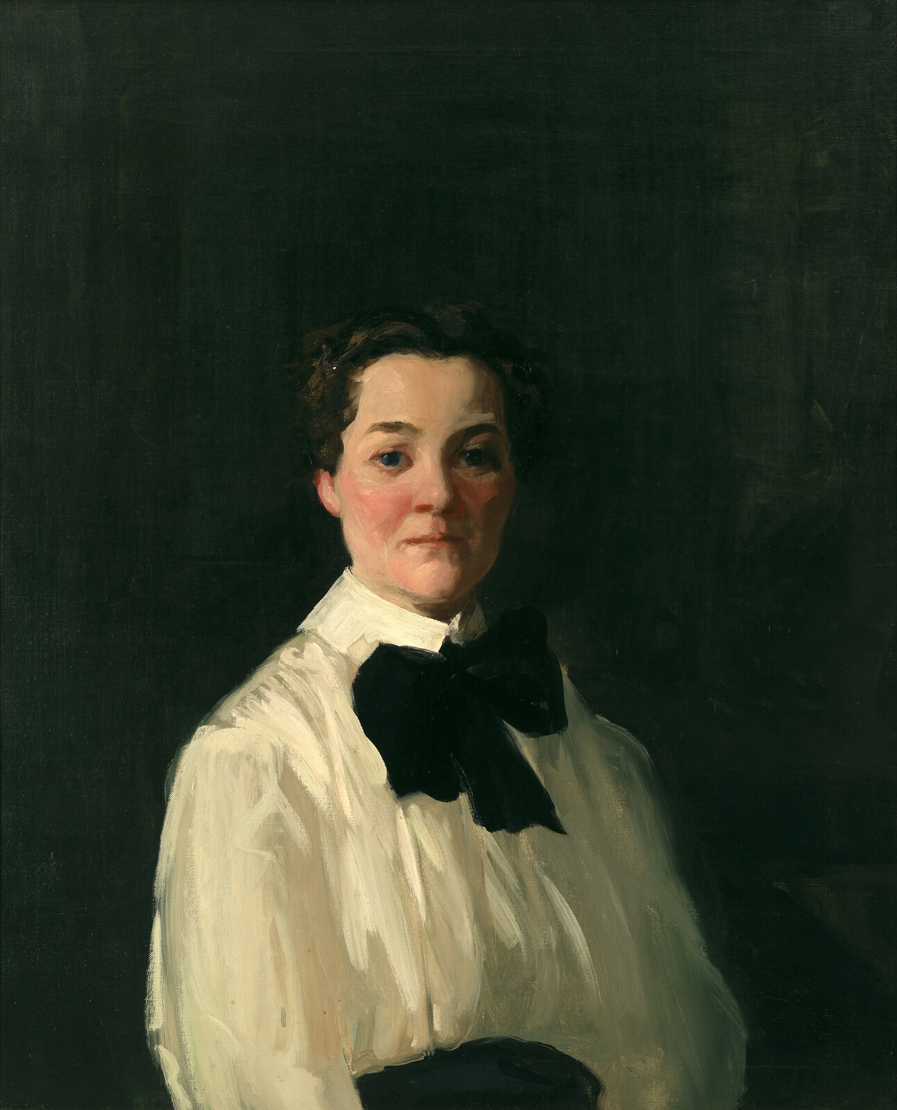 Oil painting of a woman with a confident expression, wearing a white blouse with a large black bow at the collar. The background is dark, highlighting her face and attire.