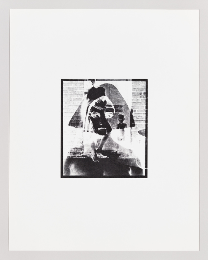 A black and white abstract artwork featuring a distorted photographic image of a figure with a prominent head and facial features, set against a brick wall background, centered on a white canvas.