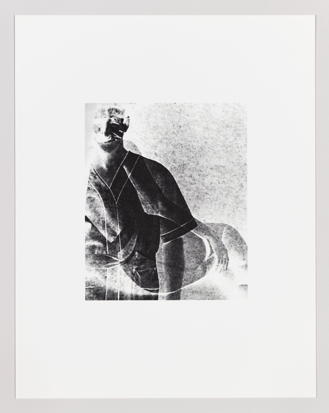 A monochromatic artwork featuring a fragmented and abstracted image of a figure, possibly male, with discernible elements such as a shoulder and head, set against a textured background, all contained within a white border.