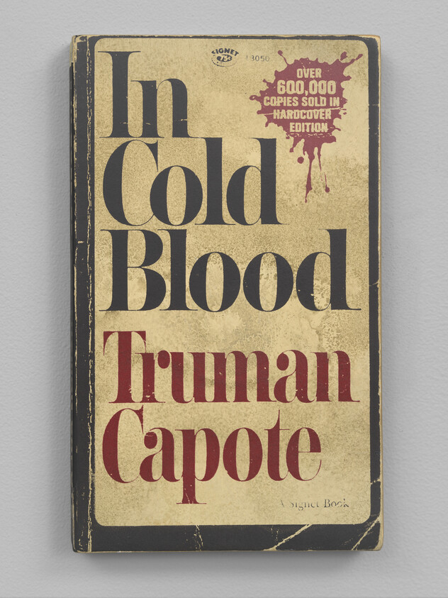 The front cover of a book titled "In Cold Blood" with worn edges and frayed corners
