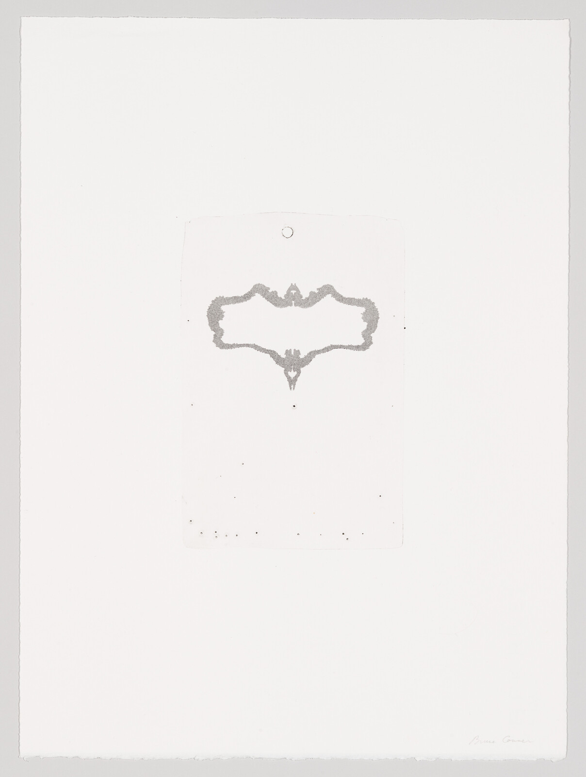 A small gray symmetrical bat-shaped inkblot appears centered on a large white paper sheet.