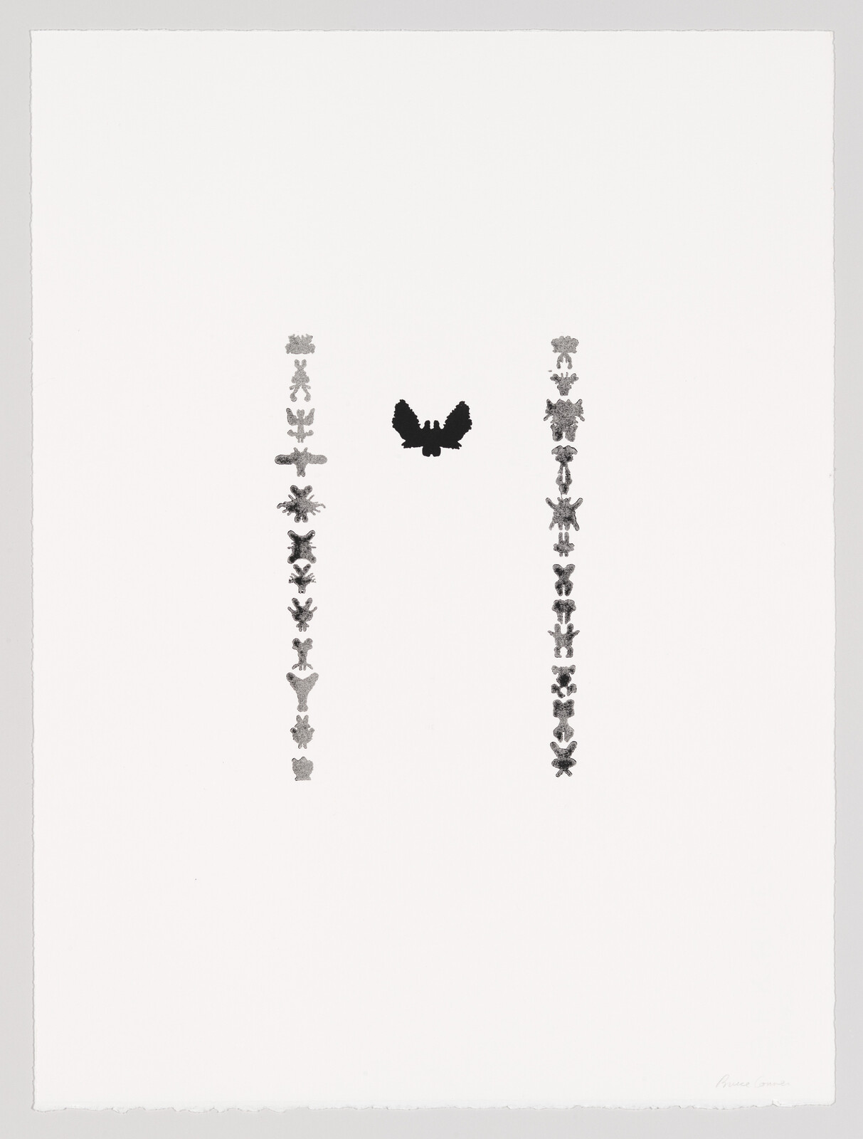 Two vertical columns of small inkblot figures with a larger black butterfly-shaped inkblot centered above.