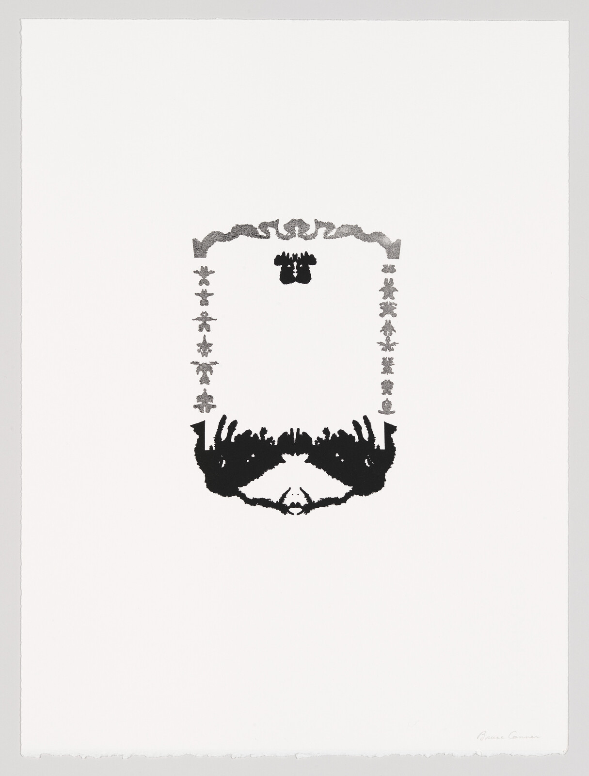 Symmetrical black and gray inkblot shapes form a vertical decorative frame and a mirrored blot near center.