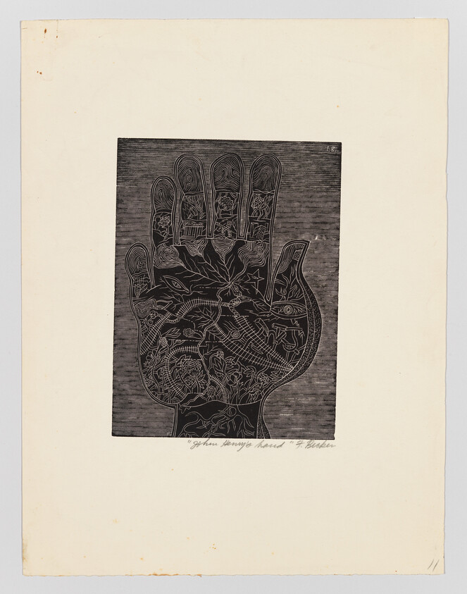 A large black hand print filled with intricate floral and animal line drawings on cream paper.