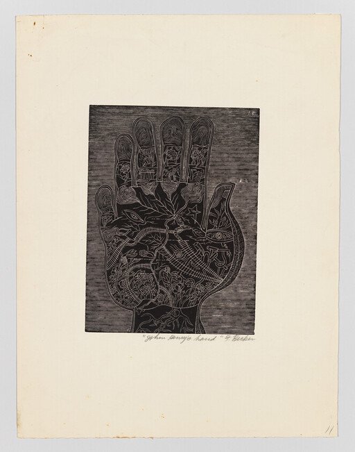 A large black hand print filled with intricate floral and animal line drawings on cream paper.