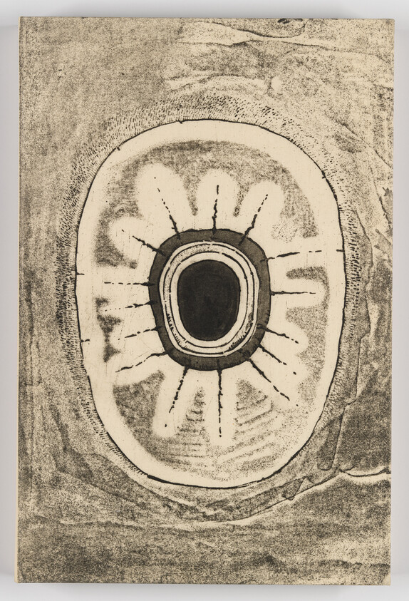 A monochrome abstract print showing concentric rings and radiating lines resembling a cross-section of a tree.