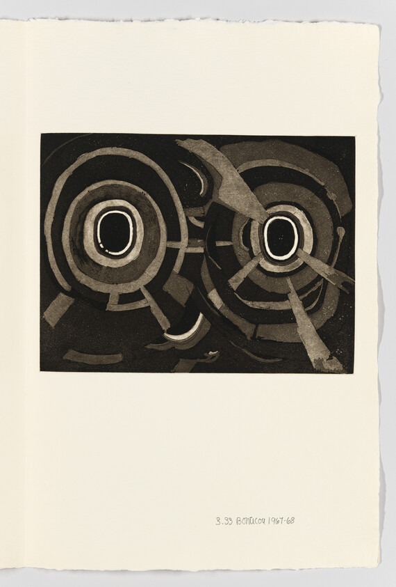 Two dark concentric circular forms with radiating bands and fragmented shapes on cream paper.