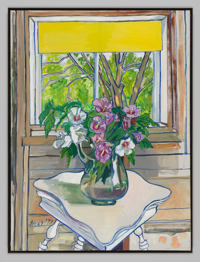 A glass vase of pink and white flowers sits on a small white table by a window.