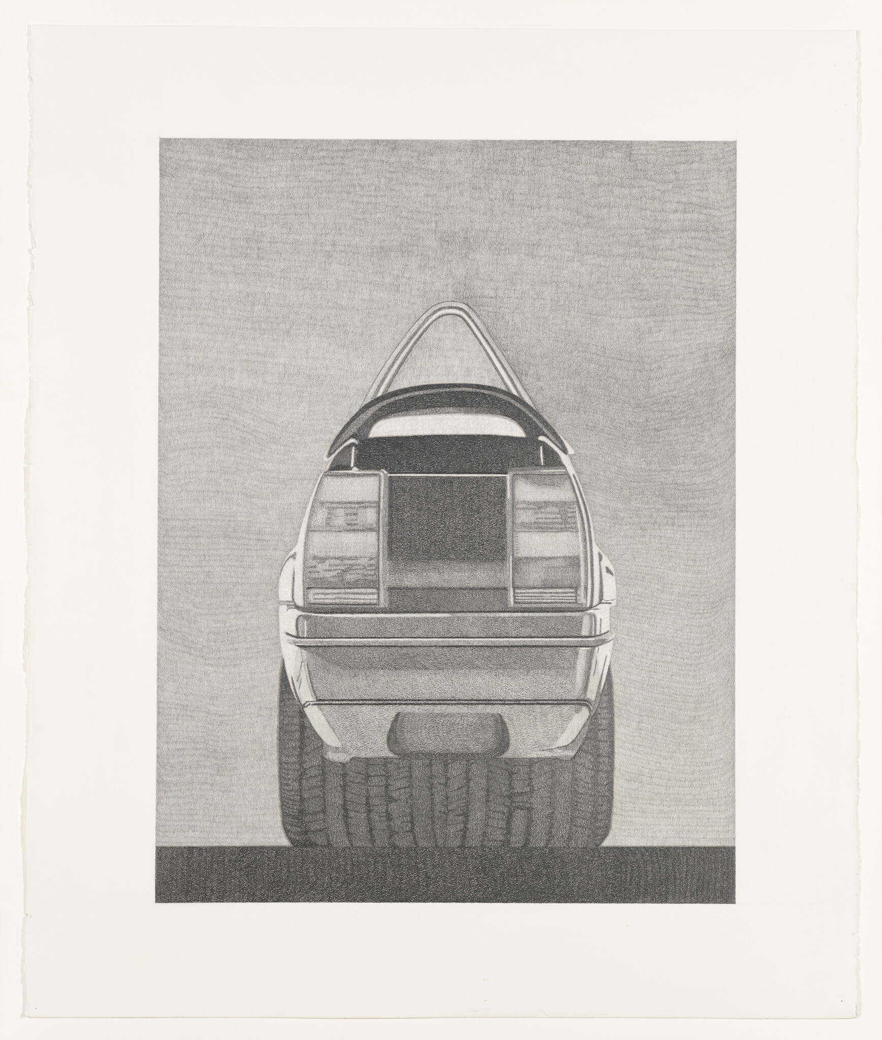 A rear view of a car with its hatch open and oversized rear tires visible.