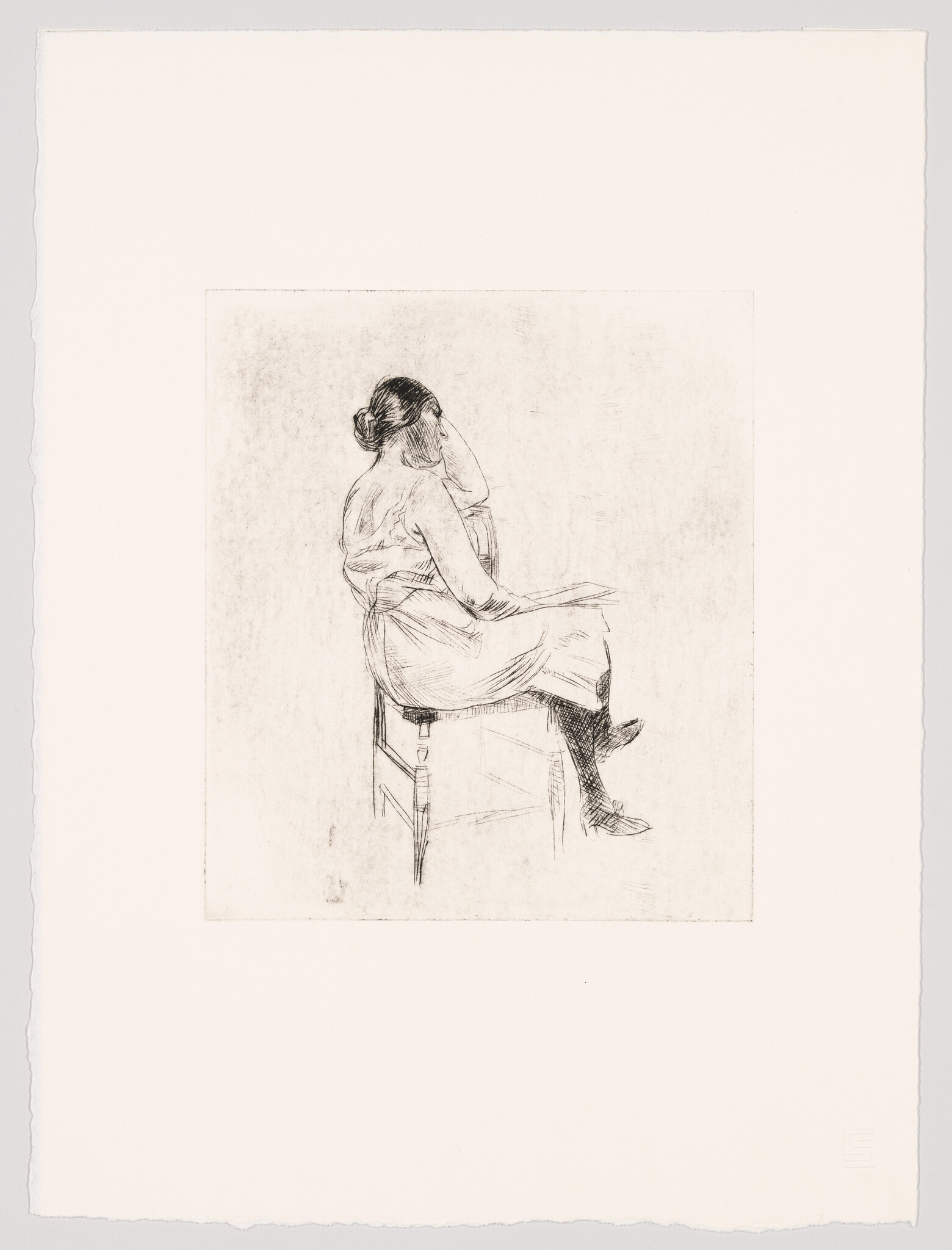 A seated woman in a simple dress rests her head on one hand while sitting on a chair.
