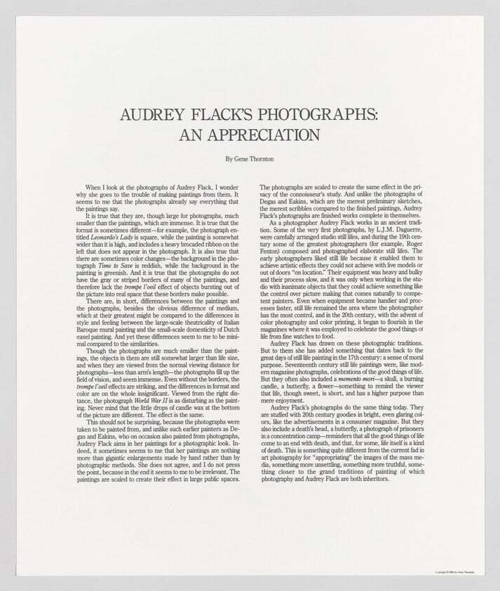 Large printed essay titled Audrey Flack's Photographs: An Appreciation with dense two-column text below.
