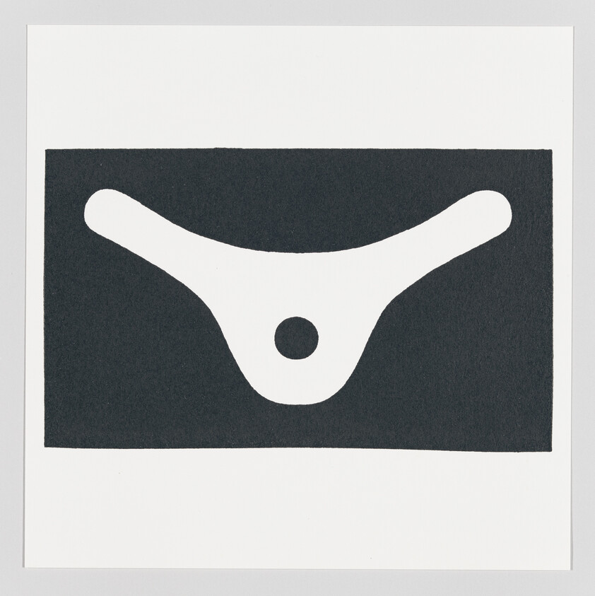 White boomerang-shaped abstract form with a central circular hole on a black rectangle.